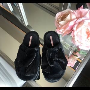 Victoria’s Secret black bow slippers.